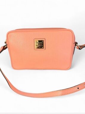 Dooney & Bourke Saffiano leather Sawyer crossbody bag in a coral pink